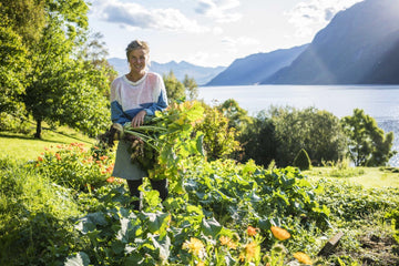 Emilie, co-founder of Moonvalley picking sustainable ingredients from her garden.